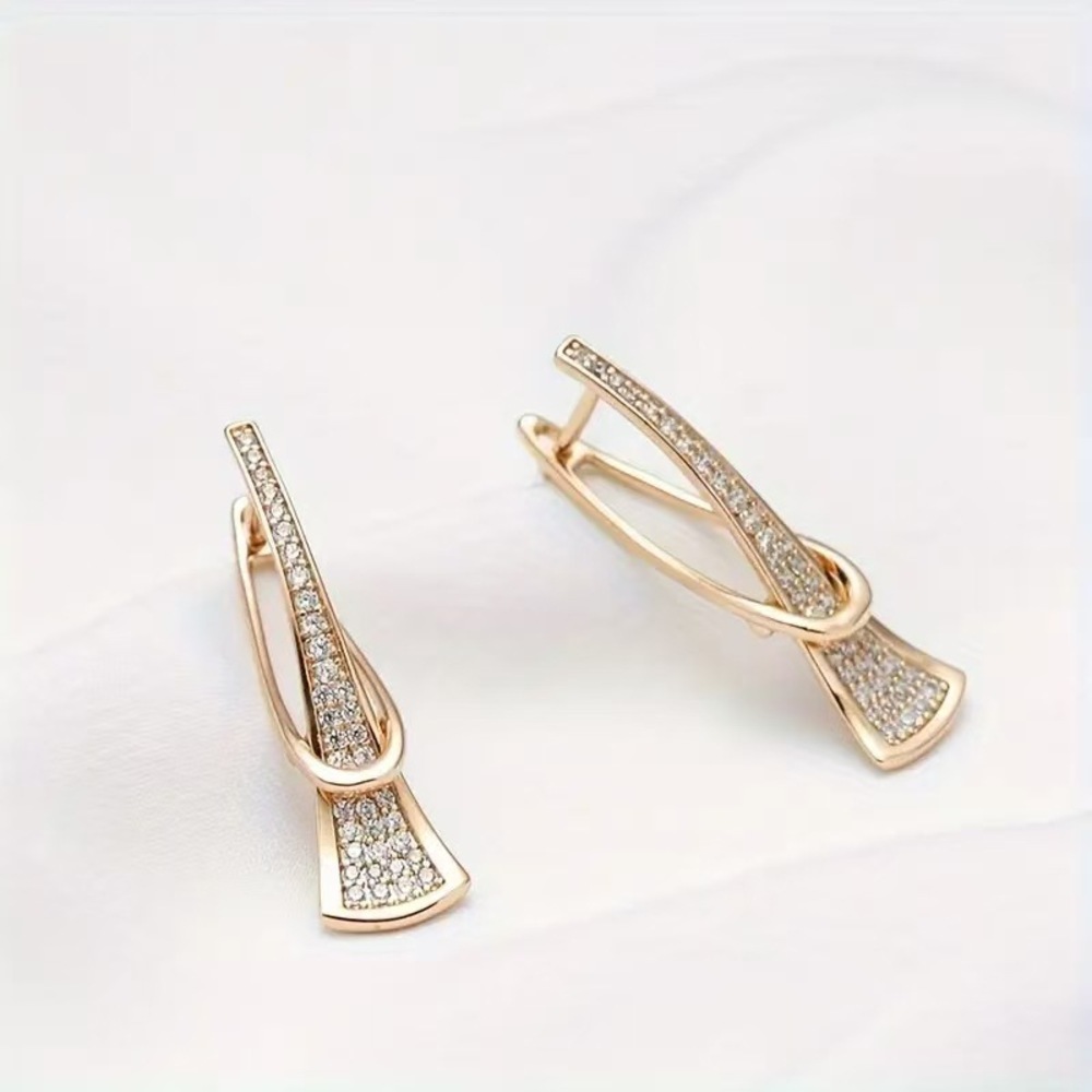 Sleek U-line earrings with a delicate hollowed bar detail. - Picture 3 of 5